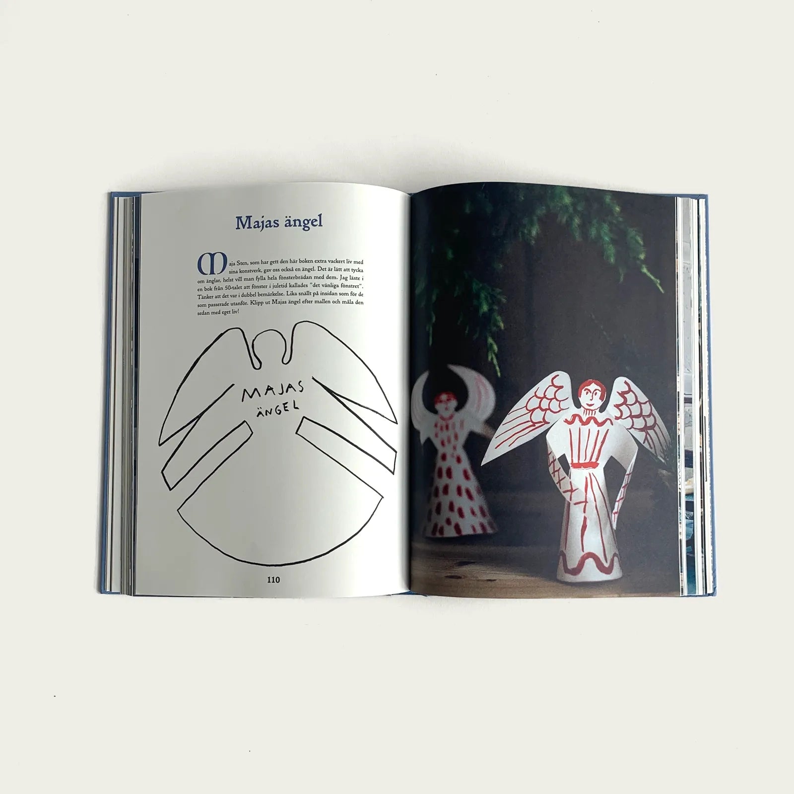 uppslag-i-boken-hidden-winter-av-forfattaren-sofia-vusir-jansson-uppslaget-visar-hur-man-viker-en-angel-i-papper